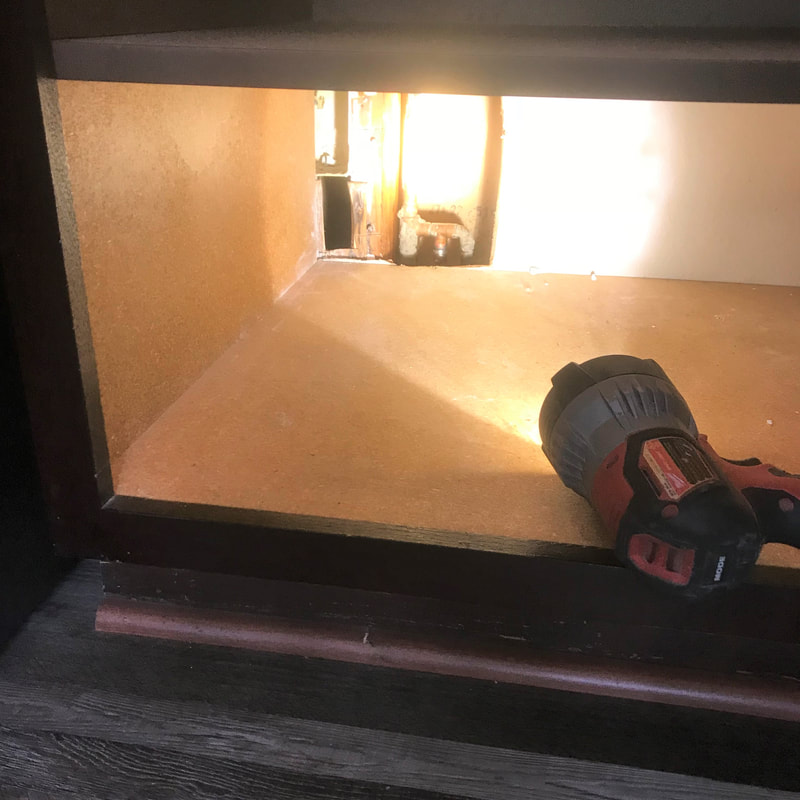 slab leak repair inside kitchen cabinet